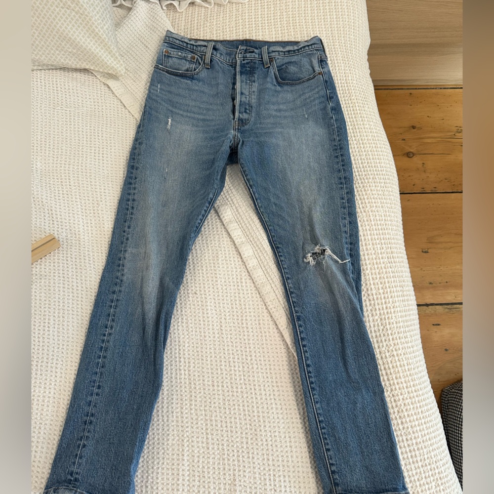 Distressed Levi’s blue jeans